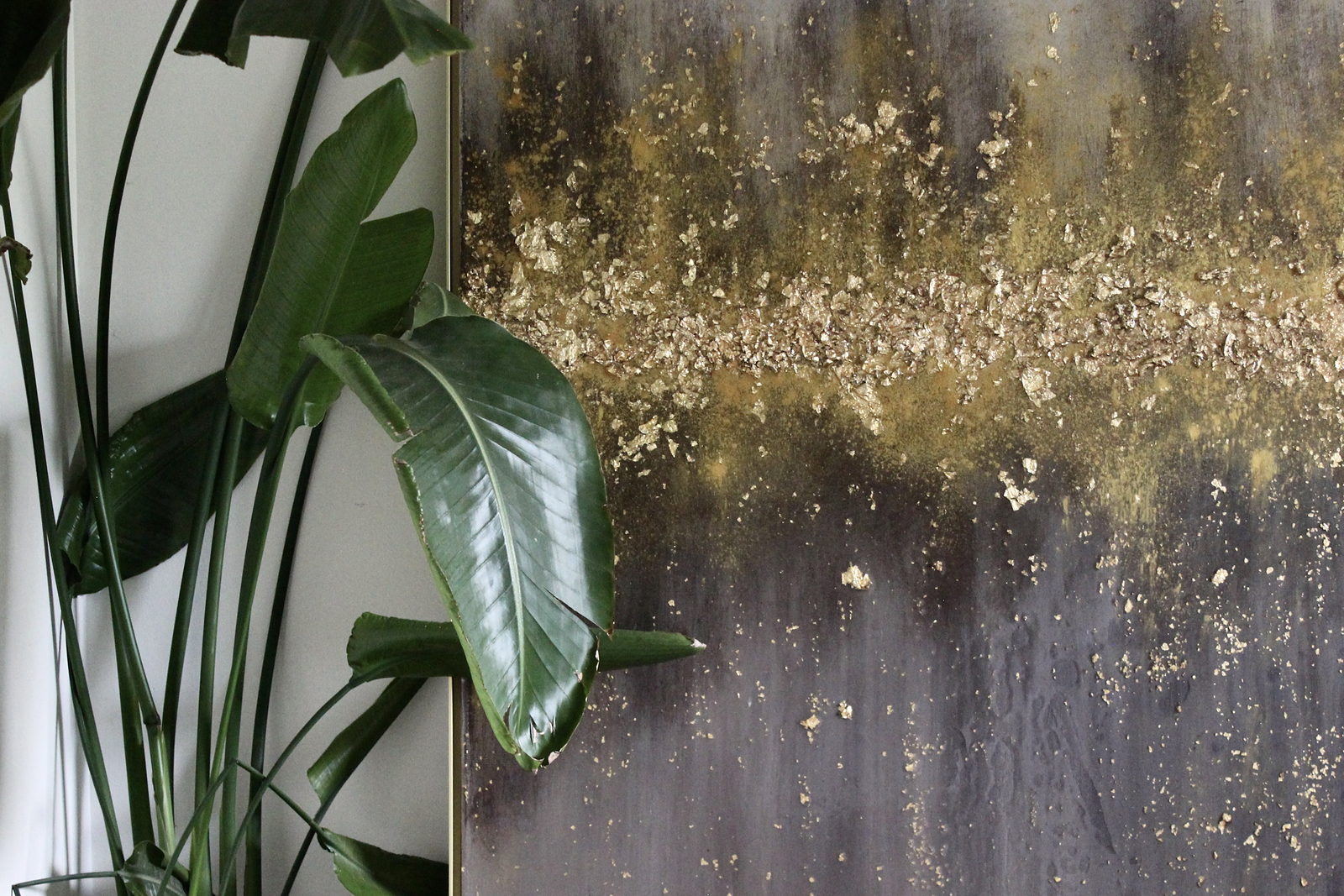 Gilded Earth, gold leaf and resin on canvas, shown in a residential interior